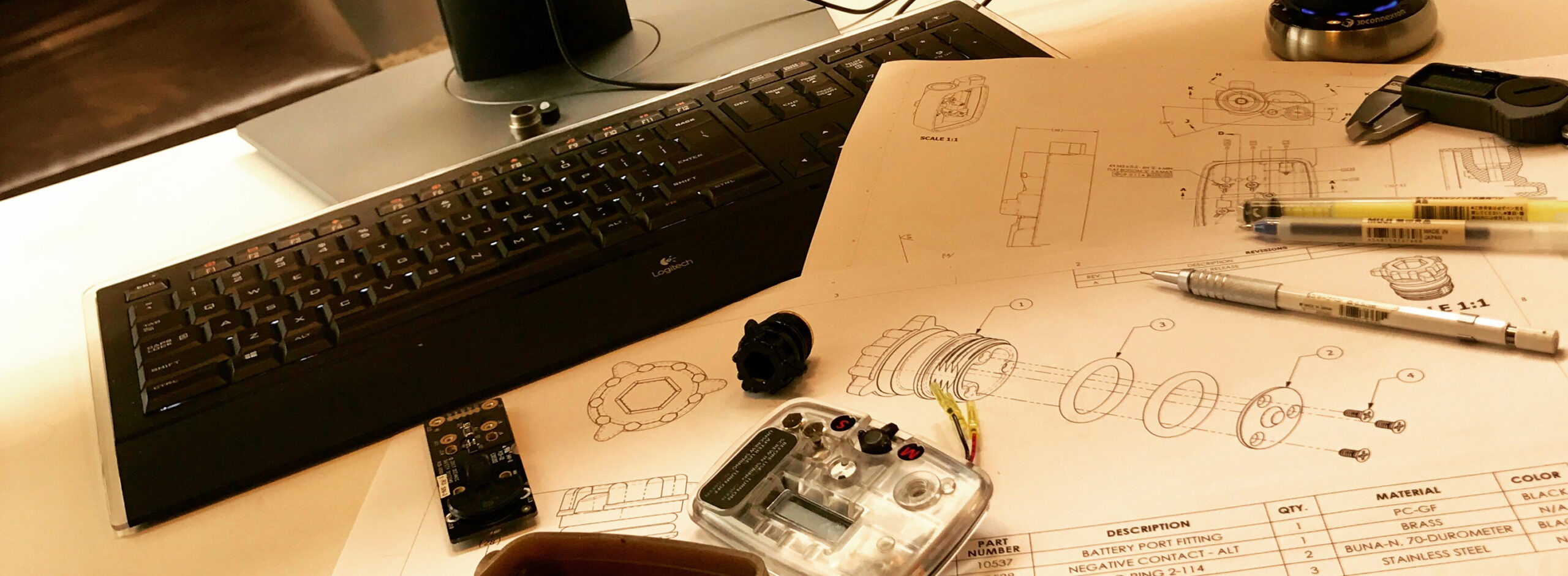 Various tools and sketches of a product in the research and development phase