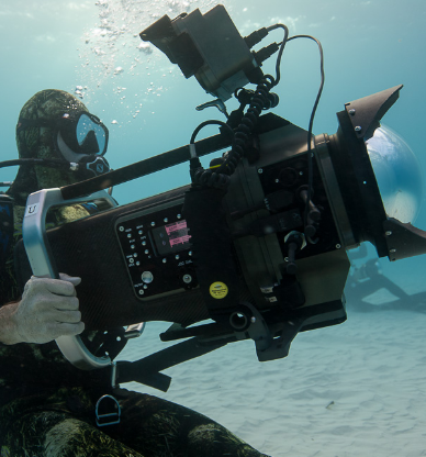 Diver holding camera designed for underwater filming
